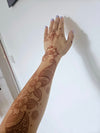 A henna artist creates custom designs with natural henna for events in Sheffield.